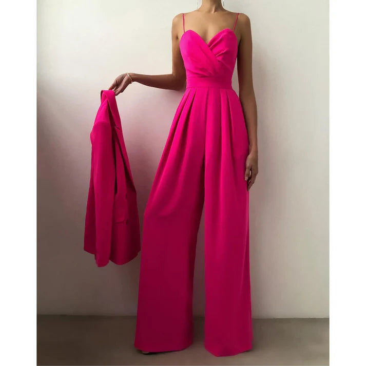 Look vibrant en combinaison rose fuchsia pour une fête glamour