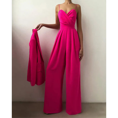 Look vibrant en combinaison rose fuchsia pour une fête glamour