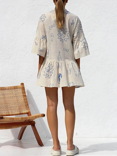 Robe tunique beige avec motifs bleus style estival, vue de dos.